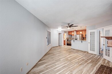 Unfurnished living room featuring light wood-type 