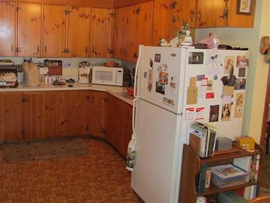 Kitchen Hardwood cabinetry abounds in the kitchen,