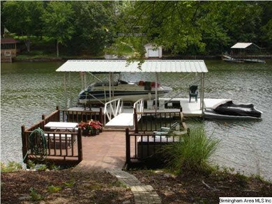 124 feet of shoreline/year round water.  Aluminum 