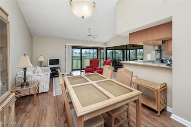 Dining room featuring vaulted ceiling, hardwood /