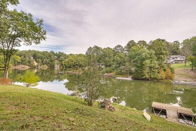 Beautiful lake views and gentle slope to the lake. Steps down on right side. Fire pit by lake shore coming soon!!