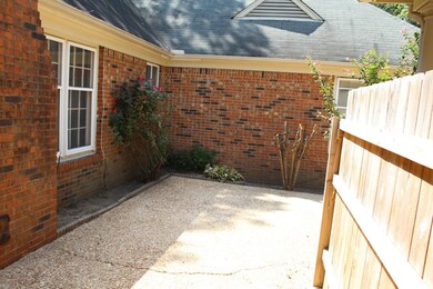 Patio area gated to back yard.