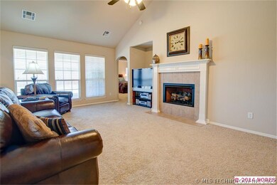 Large living area and gas log fireplace.