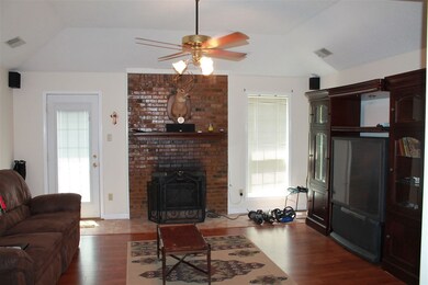 Large Great room with Hardwood Floor and Wood Burn