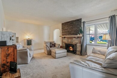 Cozy living room as seen from the stairwell, offer