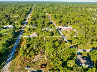 Aerial overview of property's location featuring property boundaries highlighted and a heavily wooded area