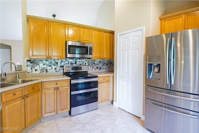 Kitchen featuring stainless steel appliances, tast