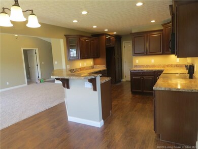 VIEW OF SPACIOUS EAT-IN KITCHEN & LIVING ROOM...