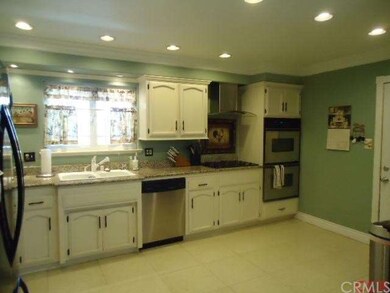 Large open style kitchen with granite counter tops