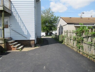View of property exterior featuring balcony and a patio area