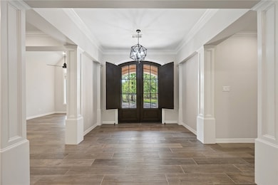 Foyer entrance with french doors, visible vents, d