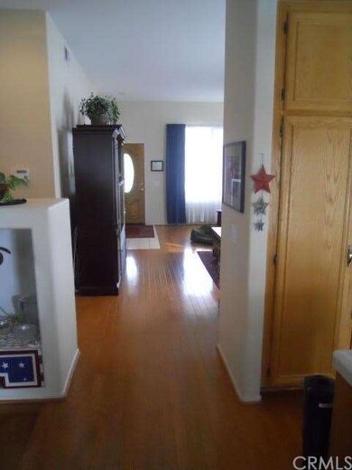 FROM FAMILY ROOM TOWARD LIVING ROOM.