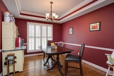 Double trey ceiling and wainscot are a knock out combination in this home. 