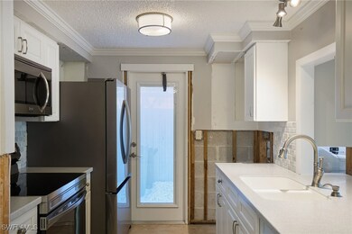 Kitchen with sink, appliances with stainless steel