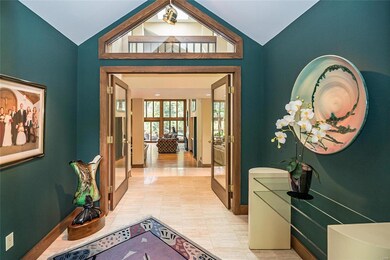 View as you enter the home. Travertine tile floors and vaulted ceiling.
