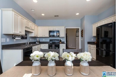 Precious eat-in kitchen is perfect for entertainin