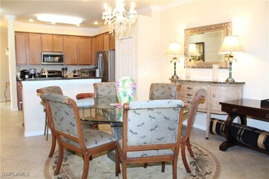 Dining space featuring light tile patterned floors