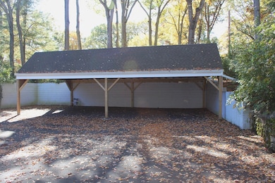 This spacious carport offers reliable protection from the elements, keeping your vehicle safe, dry, and conveniently accessible year-round.