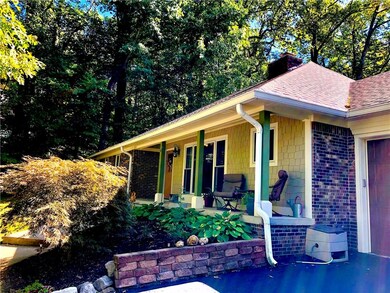 really nice covered porch to sit and enjoy the beauty of this neighborhood   the home has new roof maintenance free composite siding new windows doors hardware landscape and paint  