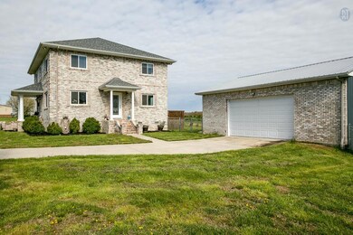VIEW OF HOME & ADDITIONAL GARAGE