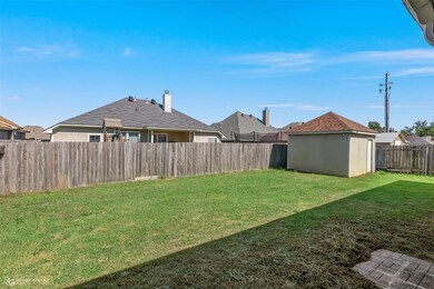 View of yard featuring a storage shed