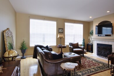 Spacious Living Room with Natural Hardwood Floors,