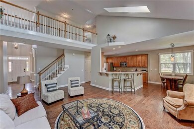 The vaulted 2-story Great Room with skylights is s