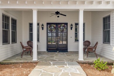 Walk up onto the stylish flagstone front porch and you'll know you've arrived somewhere special.