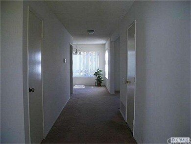 View from front door down long wide hall to dining
