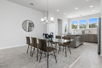 Dining space featuring baseboards, a notable chan