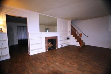 Dining room through large doorway opening...