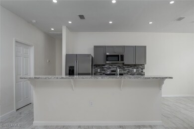 Kitchen with appliances with stainless steel finis