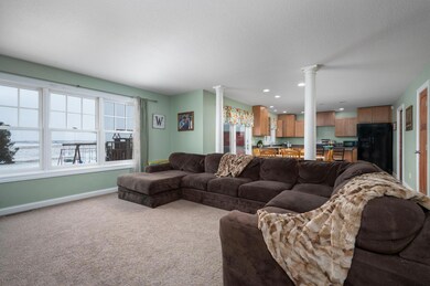 Room for a large cozy couch and window look out to the back yard