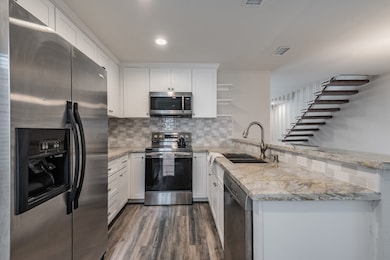 A rare two story unit with a unique floating staircase. The first floor living area measures ~15x15 feet. Fireplace is decorative.