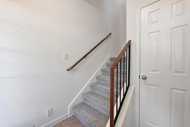 Stairs featuring baseboards