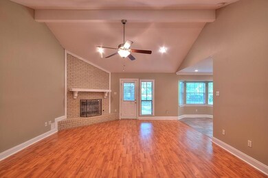 View of living room and gas fireplace from foyer.