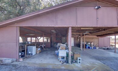 2 vehicle carport & work area.