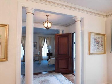 Foyer, looking into furnished living room