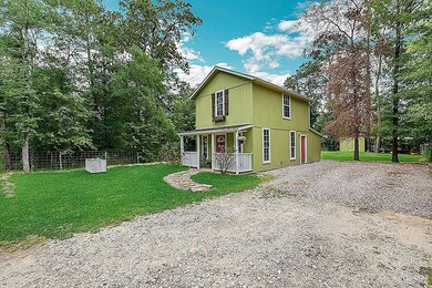 This cute cottage style home has ample yard space in both the front and back.