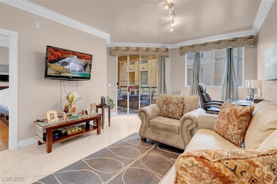 Living room with tile patterned flooring, crown mo