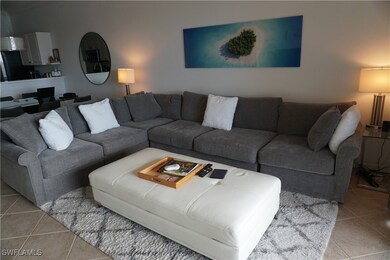 Living room with light tile patterned flooring