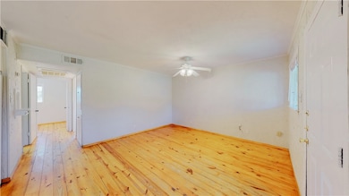 Spare room with visible vents, light wood-style fl