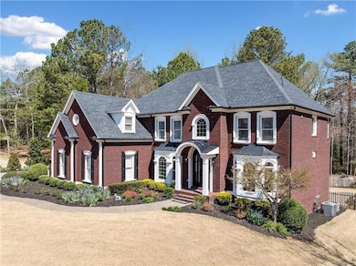 View of front of home with brick siding and central AC unit