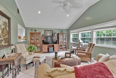 Tiled living room with ornamental molding, high va