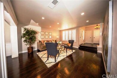 Elegant wood floors, baseboards, and recessed ligh