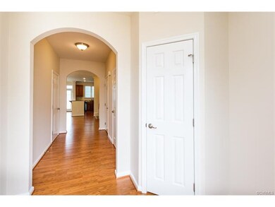 Arched foyer with coat closet