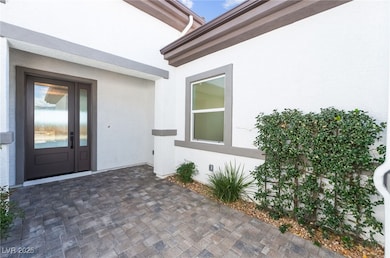 Property entrance with a patio area