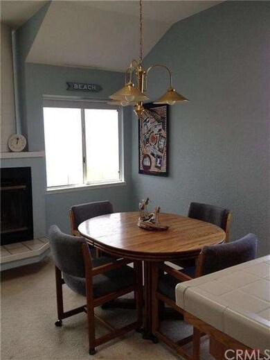 Dining area has two windows and easy access to liv