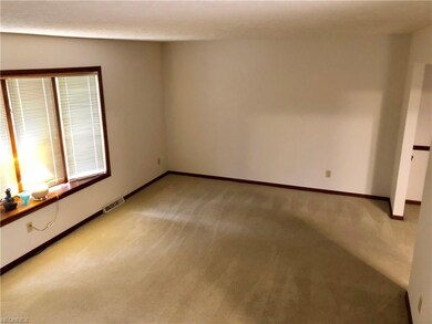 Formal living room with large bay window