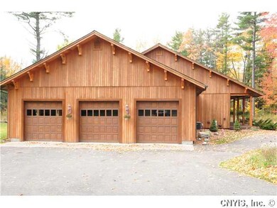 Exterior Front. 1600 square ft garage with 9 ft Ce